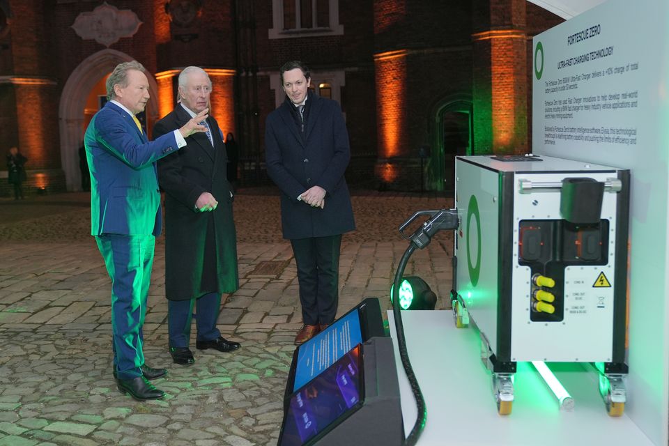 The King looking at a charging station with Andrew Forrest, of Fortescue (left), at the Sustainable Markets Initiative Terra Carta Exhibition (Yui Mok/PA)