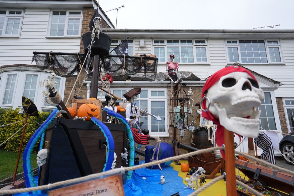 There was no holding back on the decorations at the house in Rainham, where a crew of skeleton pirates were waiting for trick-or-treaters (Gareth Fuller/PA)