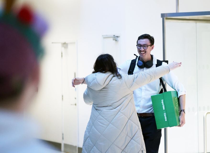 Peter Hemphill greets his mother Heather after arriving at Belfast City Airport  for the Christmas holidays, Friday, Dec. 2024.  (Picture by Peter Morrison)