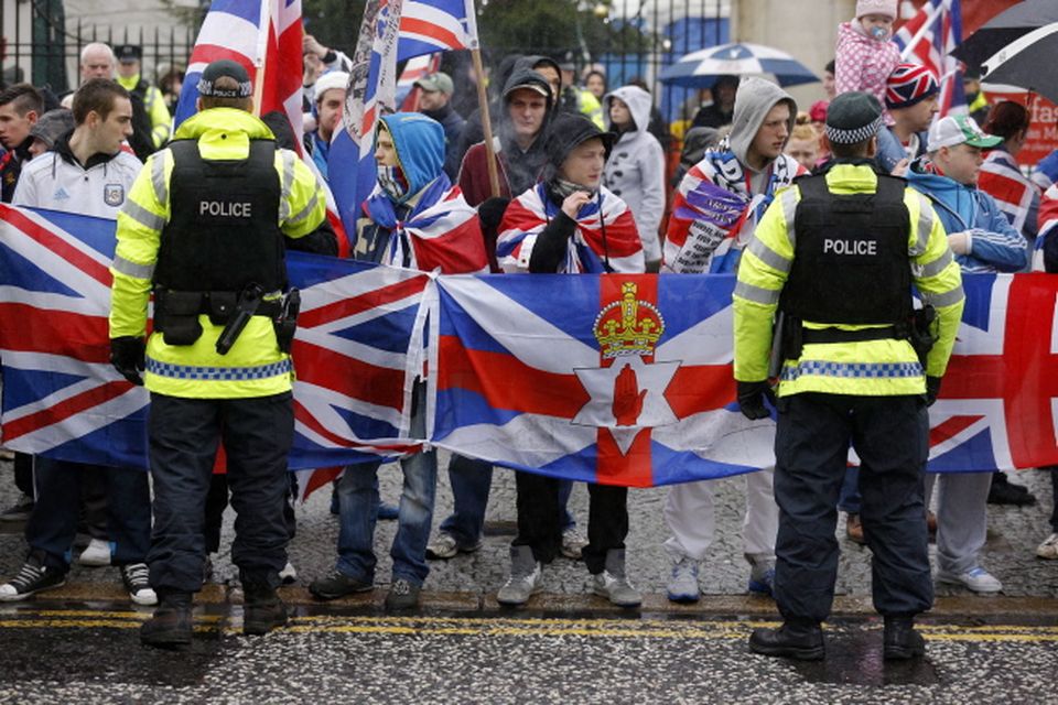 Loyalist protestors and PSNI officers pictured at Belfast City Hall on 22 December 2012