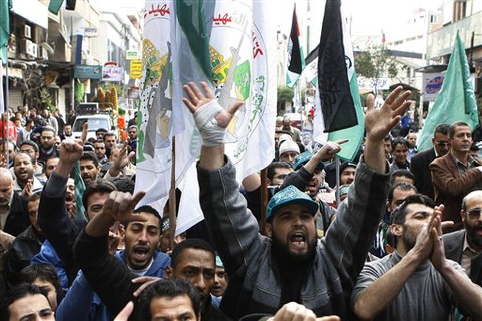 Hundreds of Hamas supporters protest in Damascus, Syria on Saturday Dec. 27, 2008 against an Israeli raid on Gaza that killed some 145 Palestinians. Israeli warplanes attacked dozens of security compounds across Hamas-ruled Gaza on Saturday in unprecedented waves of air strikes. Gaza medics said at least 145 people were killed and more than 310 wounded in the single deadliest day in Gaza fighting in recent memory.  (AP Photo Bassem/ Tellawi)