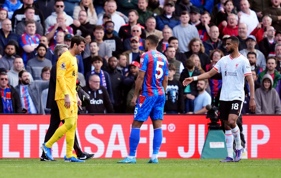 Liverpool goalkeeper Alisson Becker, left, will be sidelined for several weeks (Adam Davy/PA)