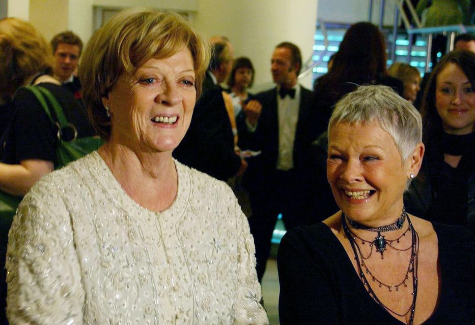 Dame Maggie Smith (left) and Dame Judi Dench arrive for a screening of Ladies In Lavender in 2004 (Ian West/PA)