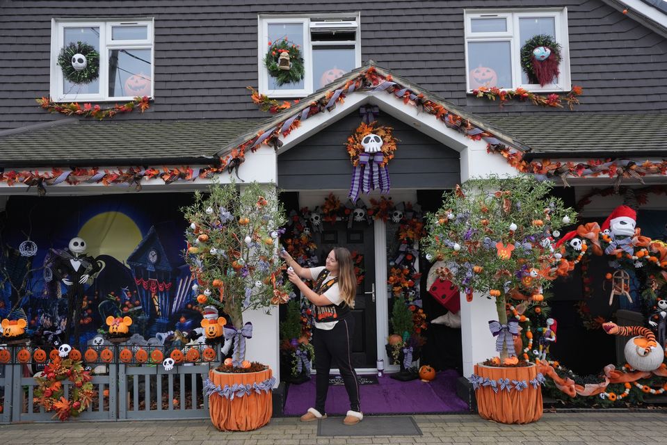 Lavinia Hedges puts the finishing touches to a Nightmare Before Christmas-themed Halloween display, which raises funds for the My Shining Star charity, at her home in Gillingham, Kent (Gareth Fuller/PA)