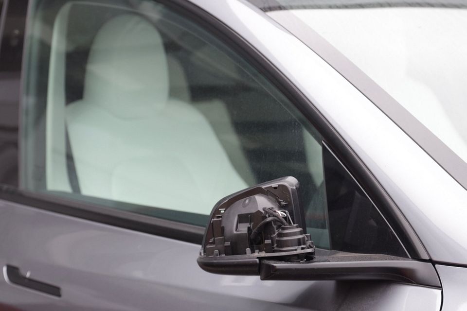 Around 20 cars were damaged at a Tesla dealership in Belfast. Photo by Pacemaker
