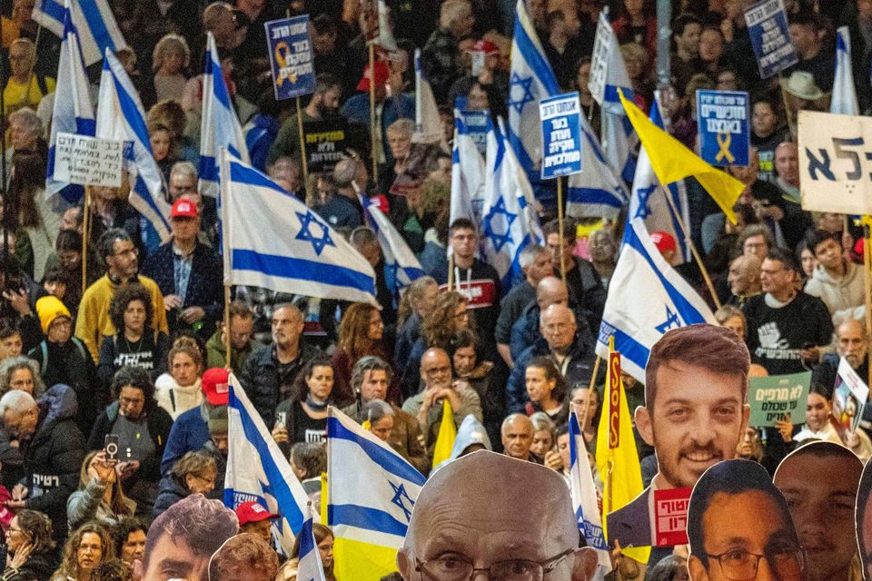 People take part in a protest in Tel Aviv demanding the immediate release of hostages held by Hamas in the Gaza Strip (Ariel Schalit/AP)