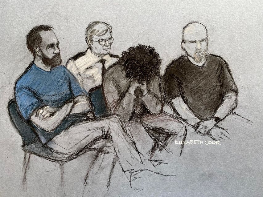 Court artist drawing of Axel Rudakubana (centre) covering his face as he appeared in the dock at Liverpool Crown Court on August 1