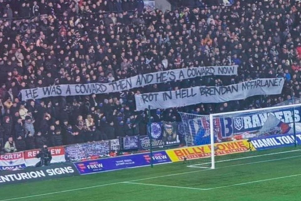 Rangers fans hold up a banner to Bik McFarlane last night