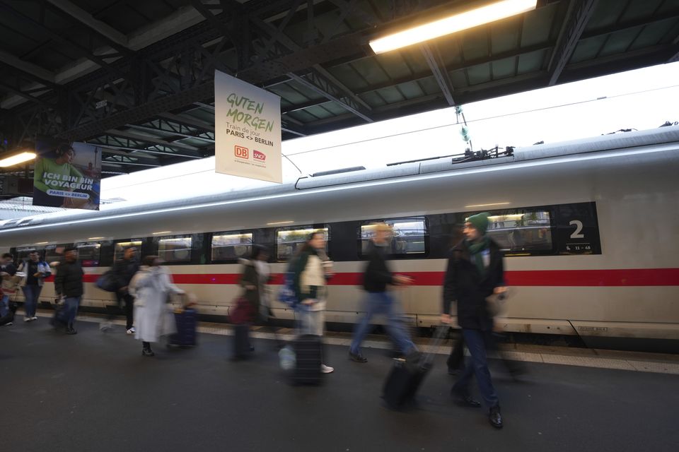 Passengers prepare to board the first Paris-Berlin high speed train (Aurelien Morissard/AP)