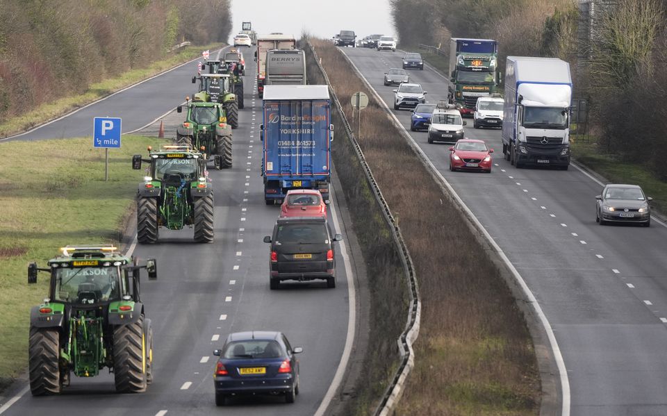 Farmers in tractors making their way along the A303 near Andover, Hampshire during a national rally organised by Farmers To Action earlier in January (Andrew Matthews/PA)