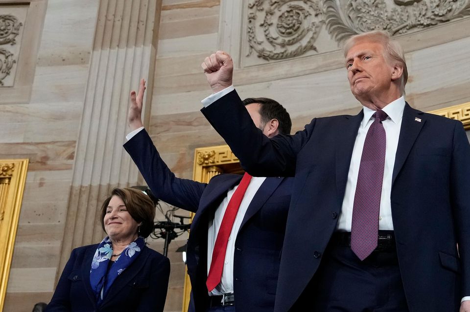 President Donald Trump gestures as he is joined on stage by vice president JD Vance after being sworn in as the 47th president of the United States (Morry Gash, Pool/AP)