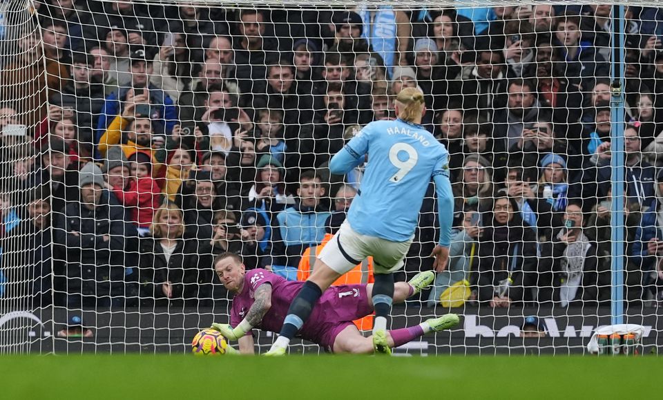 Jordan Pickford saves Erling Haaland’s penalty (Martin Rickett/PA)