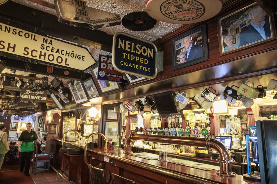 Pictures of Joe Biden during his visit hang above the bar of Fitzpatrick’s in Co Louth (Liam McBurney/PA)