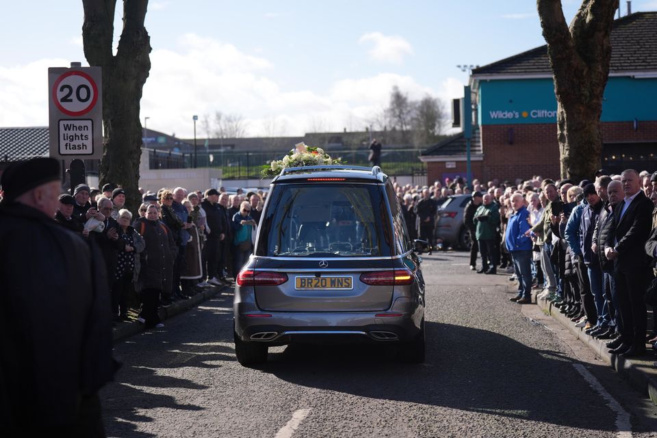 The funeral cortege for Brendan ‘Bik’ McFarlane outside his family home on Cliftonville Road, Belfast (Niall Carson/PA)