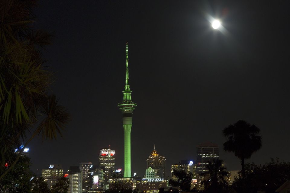 The Sky Tower in Auckland, New Zealand, illuminated in green as part of Tourism Irelands Global Greening initiative, to celebrate the island of Ireland and St Patrick.