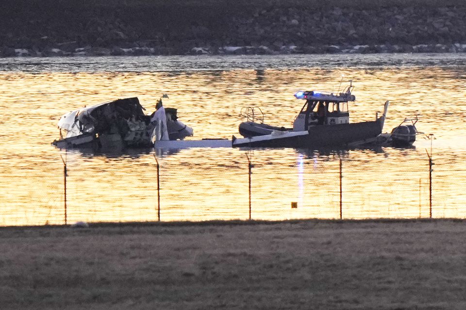 Search and rescue efforts (Mark Schiefelbein/AP)