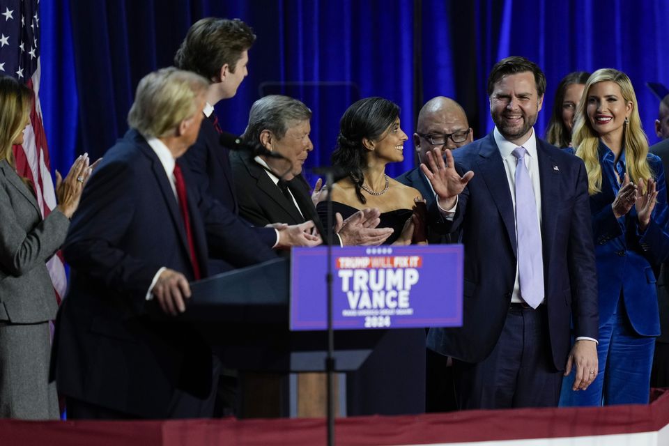 Donald Trump looks over at Republican vice presidential nominee JD Vance at the election night watch party (Julia Demaree Nikhinson/AP)