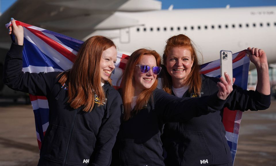 Samantha May, Elizabeth Brown and Gemma Barnes at Birmingham Airport (Joe Giddens/PA)