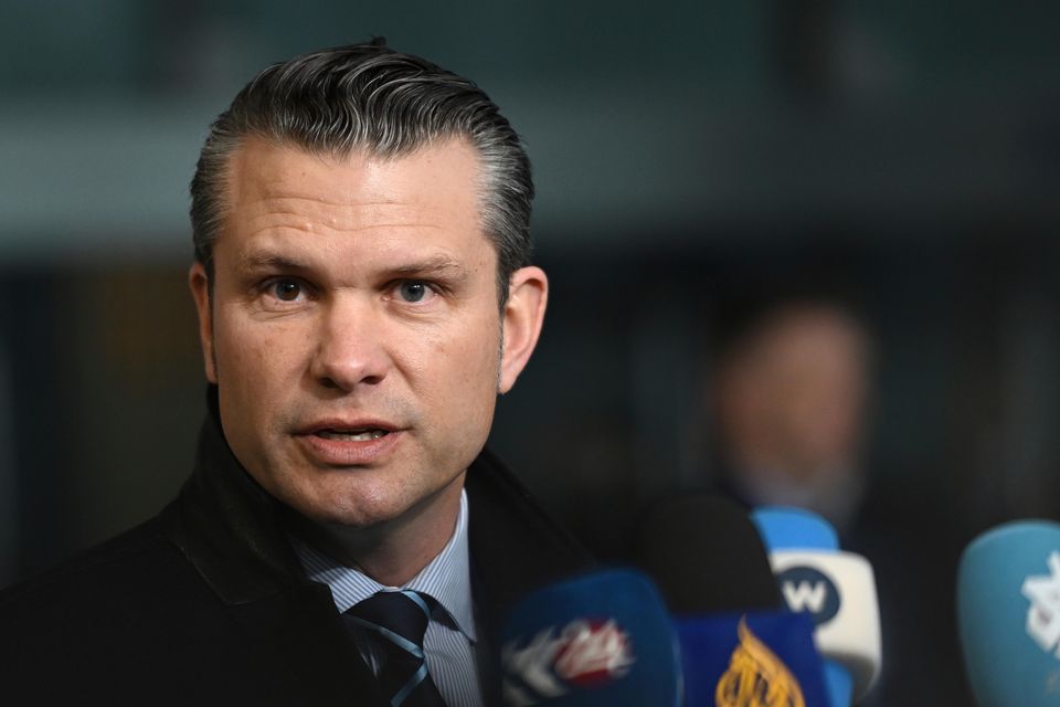 US Secretary of Defence Pete Hegseth speaks with the media as he arrives for a meeting at Nato headquarters in Brussels (Harry Nakos/AP)