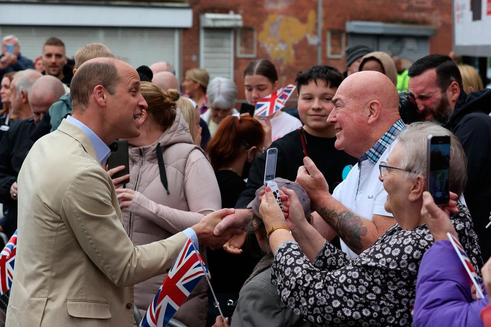 BELFAST, NORTHERN IRELAND - JUNE 27: Prince William, Prince of Wales meets members of the public after his visit to the East Belfast Mission at the Skainos Centre as part of his tour of the UK to launch a project aimed at ending homelessness on June 27, 2023 in Belfast, Northern Ireland.  William has set his sights on making rough sleeping, sofa surfing and other forms of temporary accommodation a thing of the past with his initiative called Homewards. The five-year project will initially focus on six locations, to be announced during Monday and Tuesday, where local businesses, organisations and individuals will be encouraged to join forces and develop "bespoke" action plans to tackle homelessness with up to £500,000 in funding. (Photo by Liam McBurney - Pool/Getty Images)