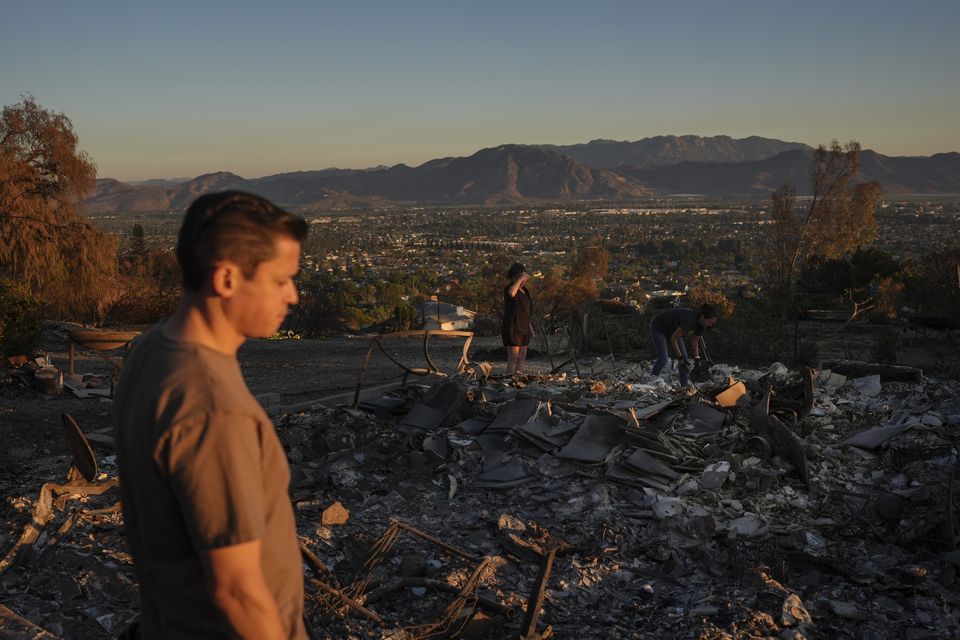 Louie Gonzalez visits what remains of his mother’s home after it was destroyed in the Mountain Fire in Camarillo (Jae C Hong/AP)