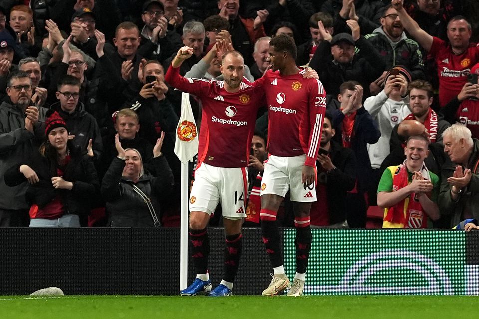 Christian Eriksen, left, celebrates his goal (Martin Rickett/PA)