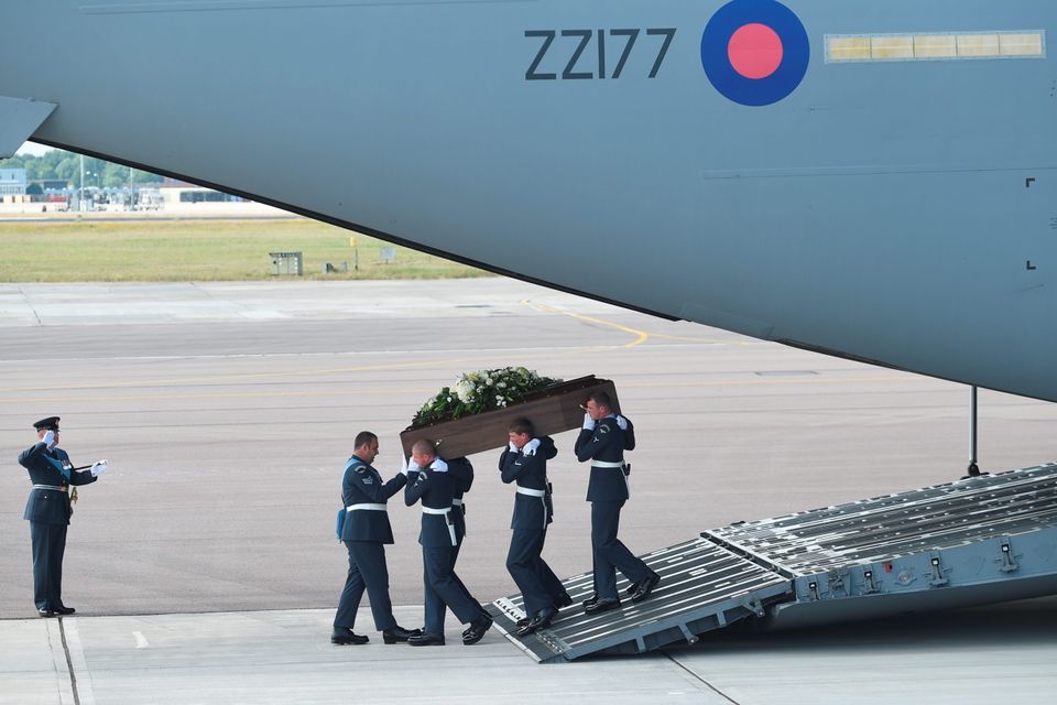 BRIZE NORTON, ENGLAND - JULY 01:  The coffin of Adrian Evans,  one of the victims of last Friday's terrorist attack, is taken from the RAF C-17 aircraft at RAF Brize Norton in Tunisia, on July 1, 2015 in Brize Norton, England. British nationals Adrian Evans, Charles Evans, Joel Richards, Carly Lovett, Stephen Mellor, John Stollery, and Denis and Elaine Thwaites are the first of the victims of last week's terror attack to be repatriated.  (Photo by Joe Giddens-WPA Pool/Getty Images) *** BESTPIX ***