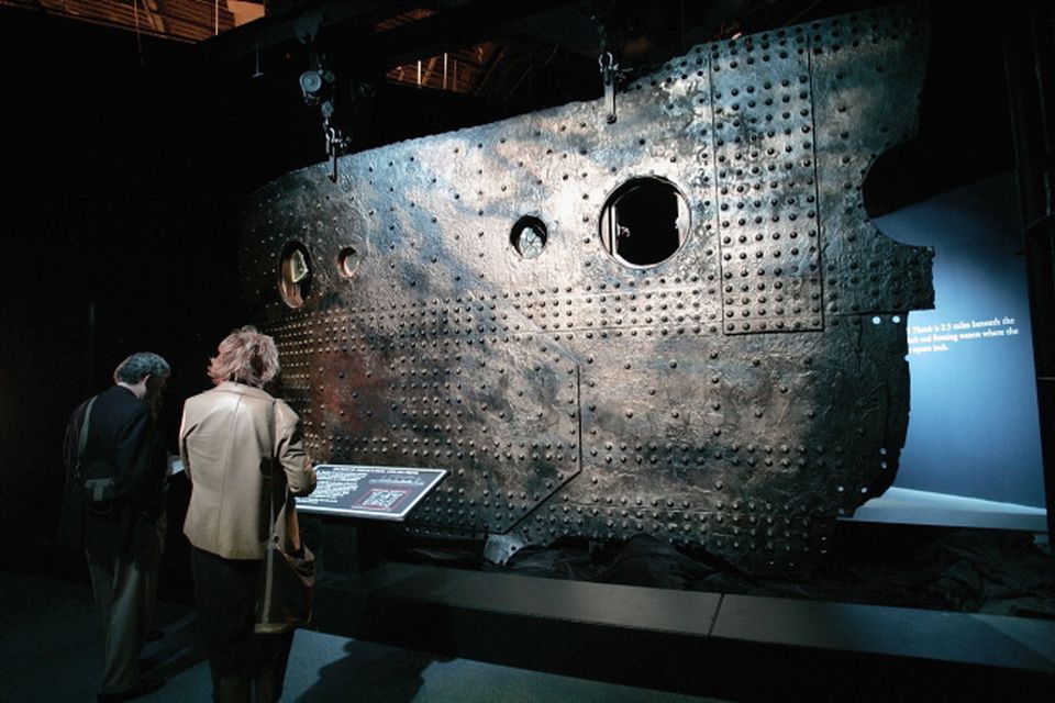 People look at the 15 ton 13' by 30' portion of the First-Class C-Deck hull, one of the artifacts from the Titanic, at the Metreon on June 6, 2006 in San Francisco, California.