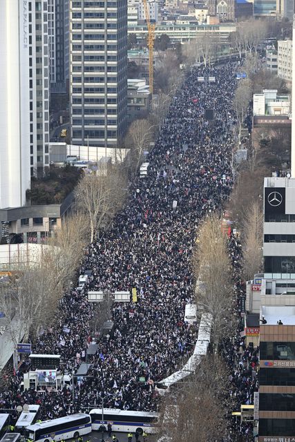 Supporters of impeached South Korean President Yoon Suk Yeol gather outside the Seoul Western District Court (Seo Dae-yeon/Yonhap/AP)