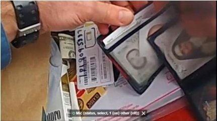 Video grab of ID cards allegedly used by Elijah Gavin from a police body-camera during a vehicle search