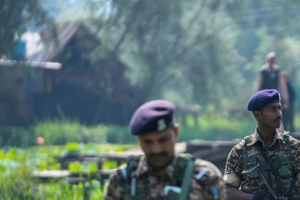 Indian soldiers on patrol during the second phase of the assembly election in Srinagar, Indian controlled Kashmir (Mukhtar Khan/AP)