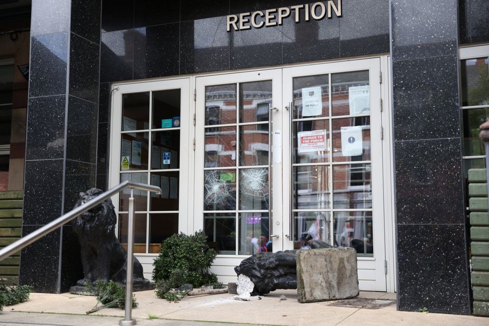 Damage to a hotel entrance in Belfast (Peter Morrison/PA)