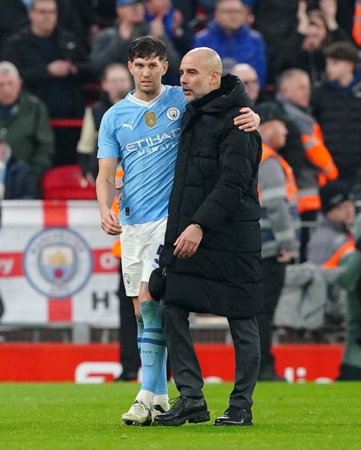 Guardiola (right) has been unable to rely on Stones this season (Peter Byrne/PA)