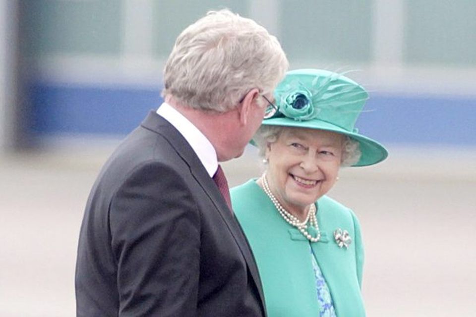 Queen Elizabeth II is greeted by Tanaiste Eamon Gilmore upon arrival at Casement Aerodrome, Baldonnel
