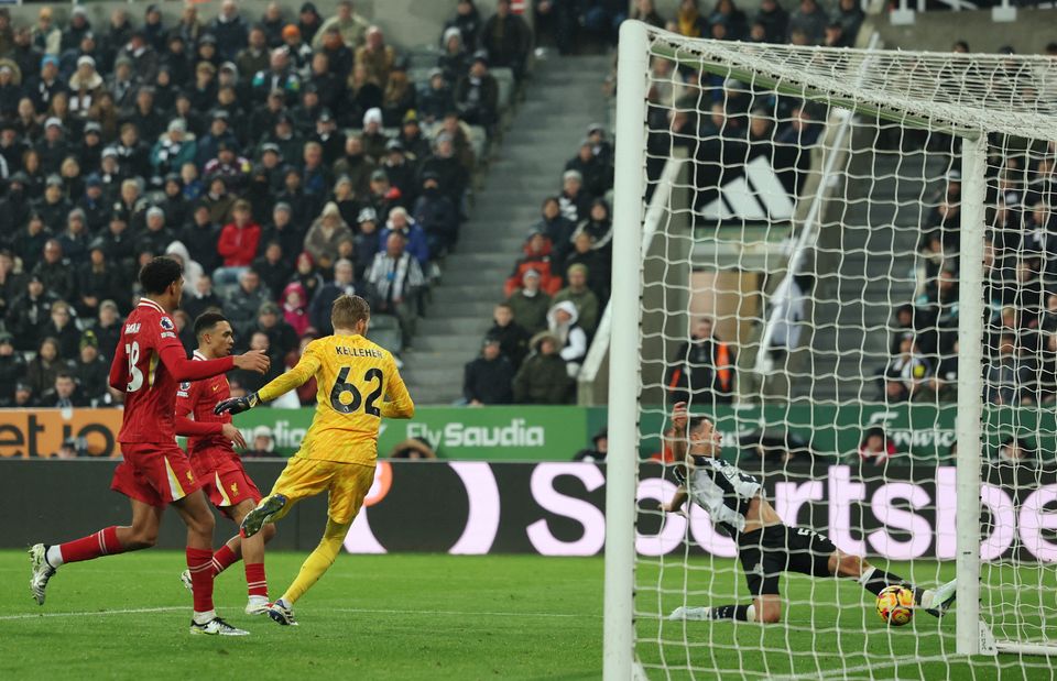 Newcastle United's Fabian Schar scores their third goal against Liverpool.