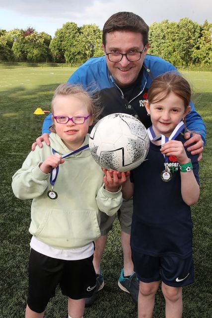 Rosario Disabled Football club coach Peter Leonard with club members Ciara Gibson (left) and Esme Mc Cann (right).