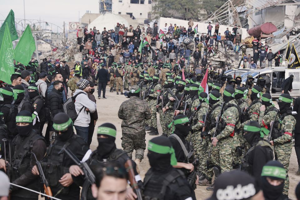 Hamas and Islamic Jihad fighters are deployed in central Gaza City ahead of the release of four Israeli female hostages (AP Photo/Abed Hajjar)