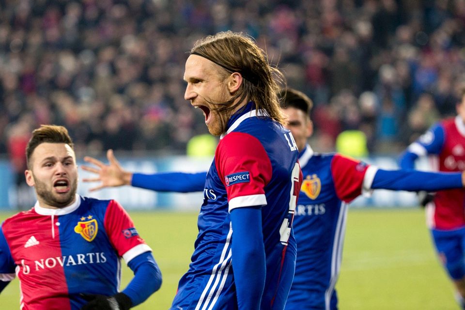 Basel's Michael Lang, center, celebrates with his teammate Basel's Renato Steffen, left, after scoring a goal, during the Champions League Group A soccer match between Switzerland's FC Basel 1893 and England's Manchester United at the St. Jakob-Park stadium in Basel, Switzerland, Wednesday, Nov. 22, 2017. (Patrick Straub/Keystone via AP)