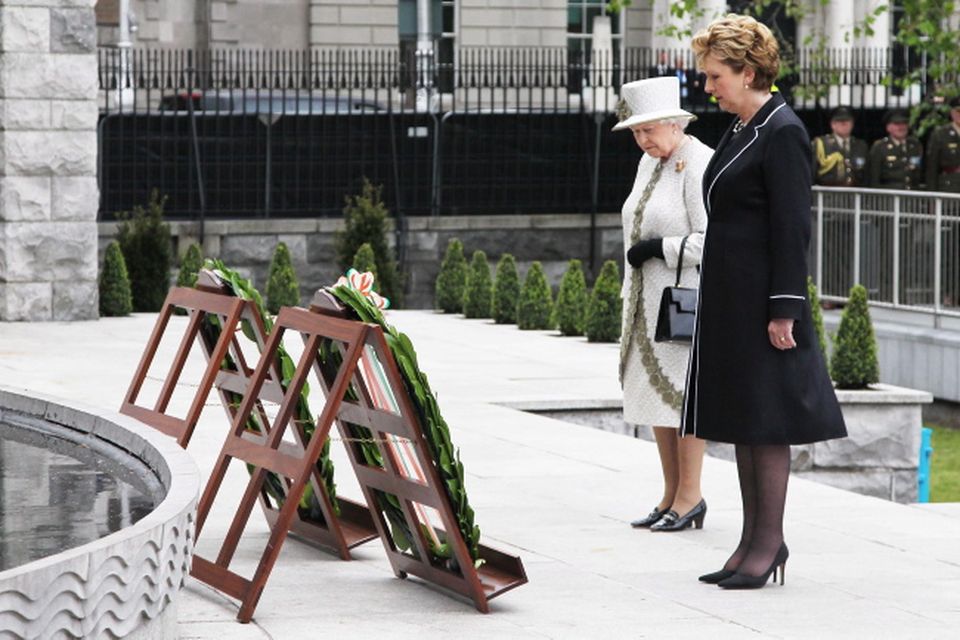 DUBLIN, IRELAND - MAY 17: Queen Elizabeth II and President Mary McAleese lay a wreaths at the Garden of Remembrance on May 17, 2011 in Dublin, Ireland. The Duke and Queen's visit is the first by a monarch since 1911. An unprecedented security operation is taking place with much of the centre of Dublin turning into a car free zone. Republican dissident groups have made it clear they are intent on disrupting proceedings.  (Photo by Irish Government - Pool/Getty Images)