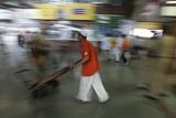 thumbnail: A worker pushes his handcart inside a waiting room at  Chhatrapati Shivaji railroad station where attacks began Wednesday with shooters spraying gunfire in Mumbai, India, Saturday, Nov. 29, 2008. Indian commandos killed the last remaining gunmen holed up at a luxury Mumbai hotel Saturday, ending a 60-hour rampage through India's financial capital by suspected Islamic militants that killed people and rocked the nation. (AP Photo/Altaf Qadri)
