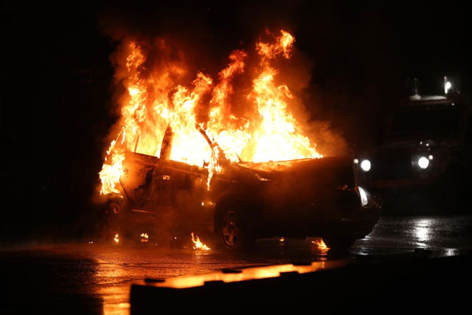 A car burns in the Castlereagh Street of east Belfast