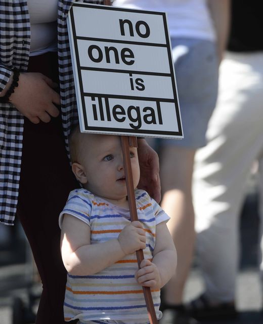 Demonstrators taking part in a United Against Racism rally in Belfast (PA)