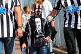thumbnail: The beautiful game - football fans from around the world -  Newcastle United fans arriving before the Premier League match at the Kirklees Stadium, Huddersfield.