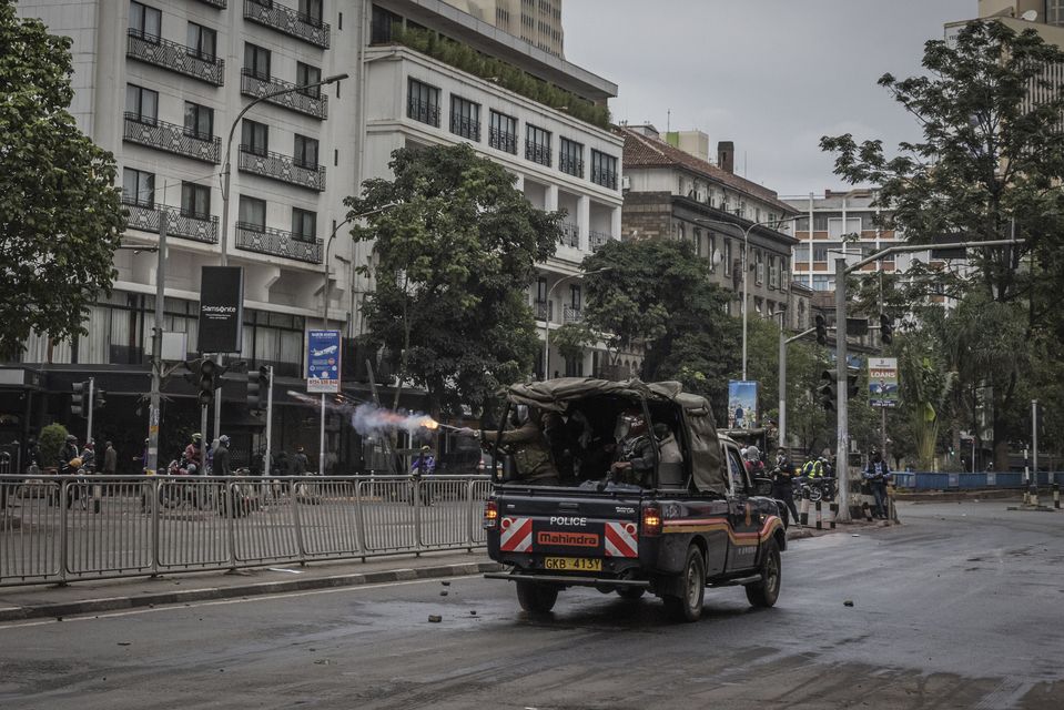 Police hurled tear gas canisters to break up protests in Nairobi on Tuesday (Ed Ram/AP)