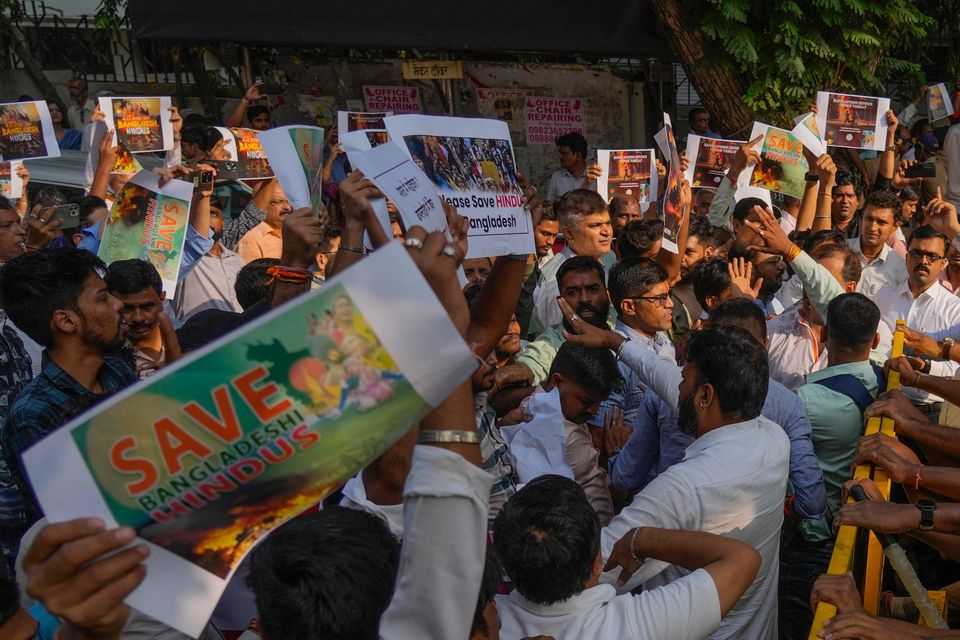 Members of Vishwa Hindu Parishad shout slogans as they are stopped by police during a protest outside the Bangladesh High Commission in Mumbai, India (Rafiq Maqbool/AP)