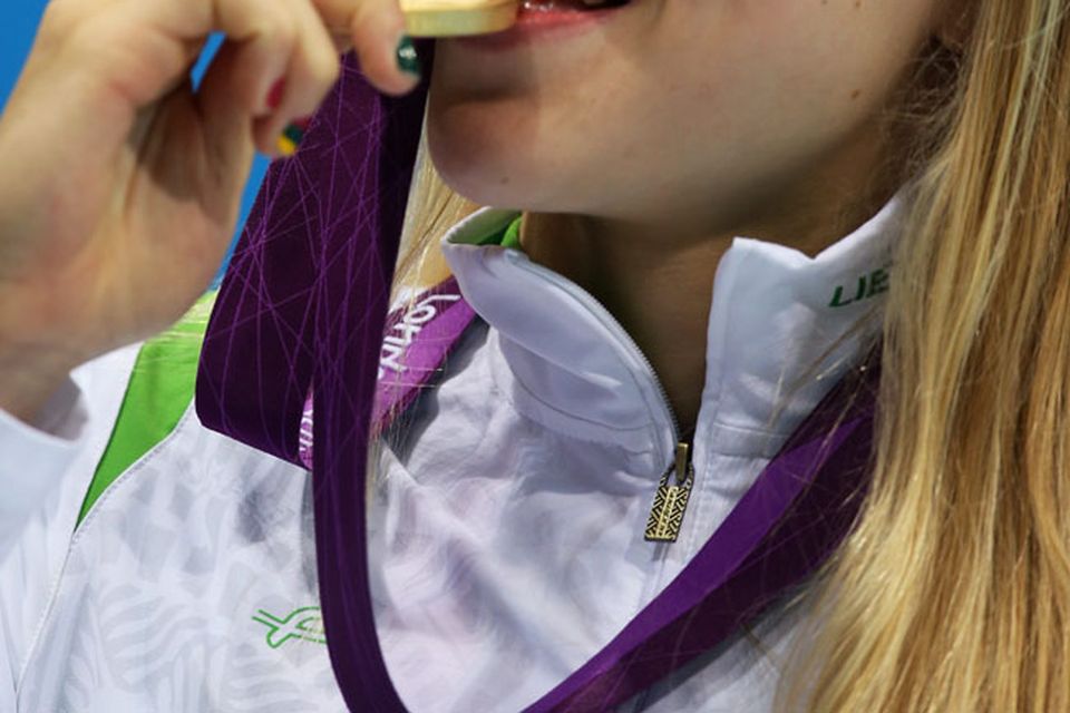 LONDON, ENGLAND - JULY 30:  Ruta Meilutyte of Lithuania celebrates with her gold medal during the medal ceremony for the Women's 100m Breaststroke on Day 3 of the London 2012 Olympic Games at the Aquatics Centre on July 30, 2012 in London, England.  (Photo by Clive Rose/Getty Images)