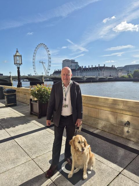 Liberal Democrat Steve Darling with his guide dog Jennie (Liberal Democrats/PA)