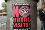 thumbnail: A sticker on a lamppost critical of the state visit to Ireland by the Queen.