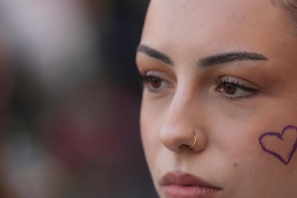 Many marchers called for an end to violence against women (Darko Vojinovic/AP)