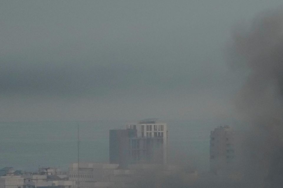 Smoke rises from Israeli air strikes in Beirut’s southern suburbs (Hussein Malla/AP)